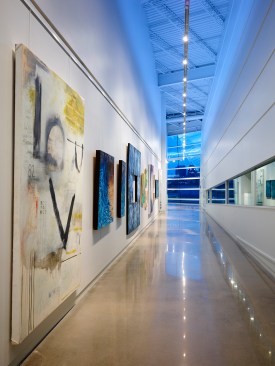 The art gallery and boat storage spaces are placed side by side to illustrate their connection.  Track lighting and blue atmospheric lighting create universal space.  