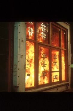 UL’s testing process involves placing test assemblies in a furnace and exposing one face to fire to determine the fire rating. In the case of glass assemblies (shown here), the fire is evident during the testing process.
