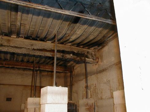 In the case of opaque assemblies, the testers must rely more on temperatures collected by thermocouples inside the furnace. After the test fire is extinguished, UL technicians can compile the temperature data, along with information such as roof-deck deformation (shown here) and material failure to help determine the rating (in hours) that each assembly receives.