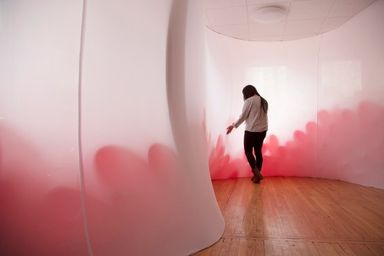 The Fossa Olfactoria installation features balloons filled with scented oil placed behind a “fleshy fabric membrane” to highlight the connection between the olfactory system (responsible for our sense of smell) and tactile experiences.