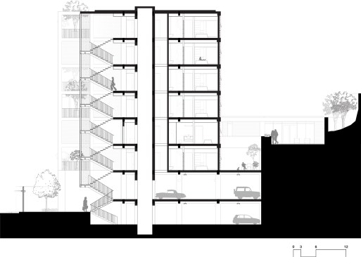 To minimize the grading of the hillside site, Design Opera chose to do a split-level parking garage, going 6 feet below street level on the east side and 6 feet above on the west side. 