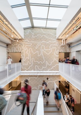 Main stair at third floor, showing topographic map wall graphics by KEA