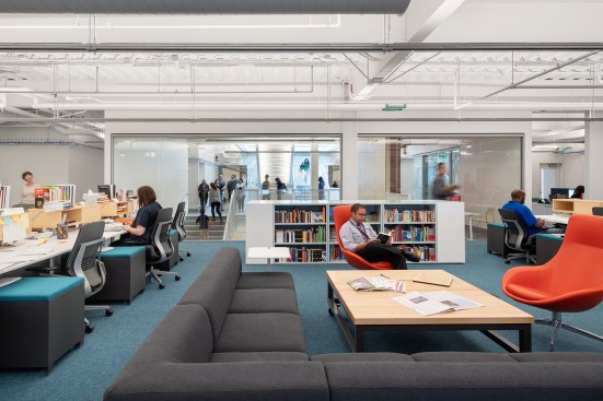 Second-floor faculty office, with visual connections to main stair and open library through glass wall 
