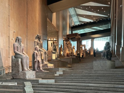 Ascending galleries mimic the elevation change from the Nile Valley to the desert plateau.
