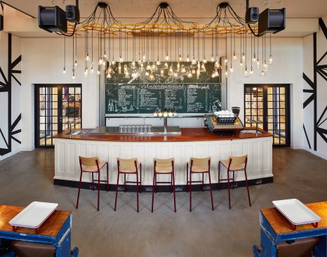 In a nod to the building's past as a laboratory building, The Auditorium Bar features a lighting installation composed of glass flasks and beakers found on site.