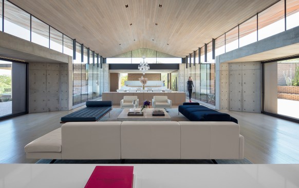 Custom windows from Metalworks line the open living area.