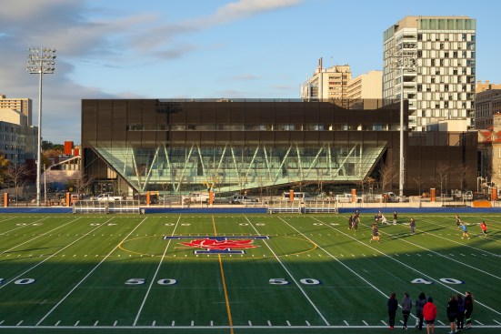 View of east façade  over adjacent playing field.
