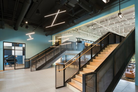 Two staircases connect the building’s lower level to the new mezzanine. 