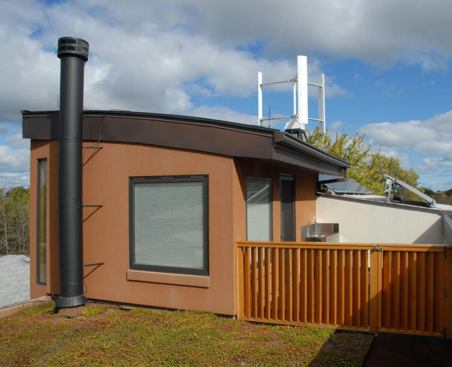 The vegetative green roof reduces water runoff and helps to insulate the roof.
