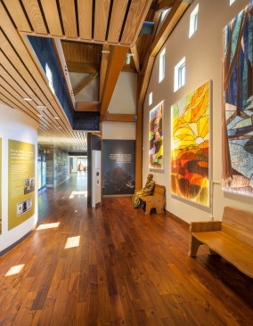 Scrims on an abstract wall of windows create a lighting effect similar to that of stained glass.