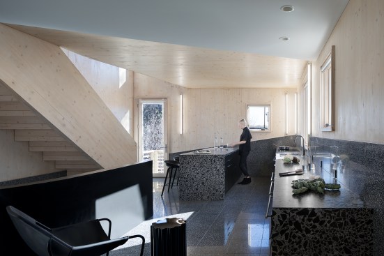 The ground-floor kitchen features EcoTerr tile floors. 