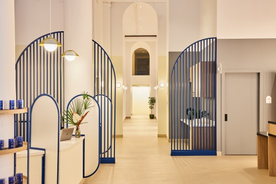 The reception area and waiting room for the flagship location of HealthQuarters, a health care start-up in New York, make it clear that this isn't your traditional doctorâs office. Slatted screens demarcate different program areas in the three-story project, and white-oak millwork and curved accents help create an inviting atmosphere.
