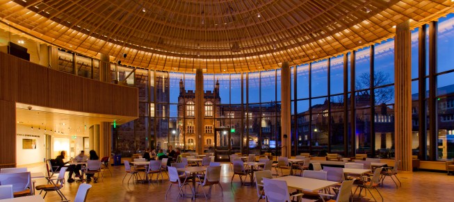 A view from inside the Forum at night, looking out to the WashU campus.