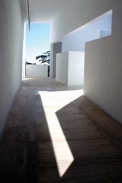 By day, color at the Hotel Encanto Color takes on its most basic form—light and shadow—as seen in one the hotel passageways.