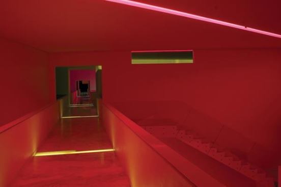 At night the hotel is bathed in rich colors. The tower lounge area is set off in a wash of deep red creating a dramatic affect and accentuating the architecture.