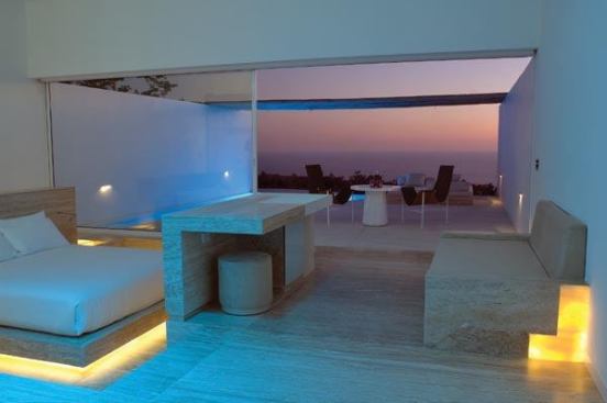 Accents of yellow light articulate the edges of the built in furnishings in the guest rooms.