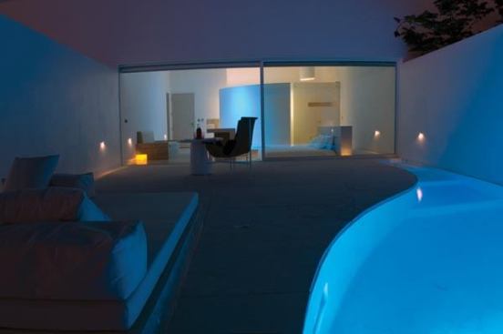 Interior and exterior become one in the guest rooms where light washes vertical and horizontal surfaces to create a unified space.