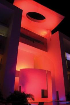 At night the hotel is bathed in rich colors. The tower lounge area is set off in a wash of deep red creating a dramatic affect and accentuating the architecture.