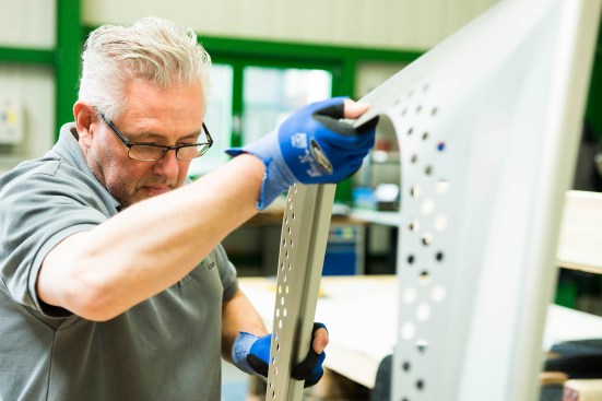 Hand-finishing and quality control inspection of a panel