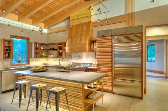 In the kitchen, concrete floors and countertops are warmed by lots of wood.