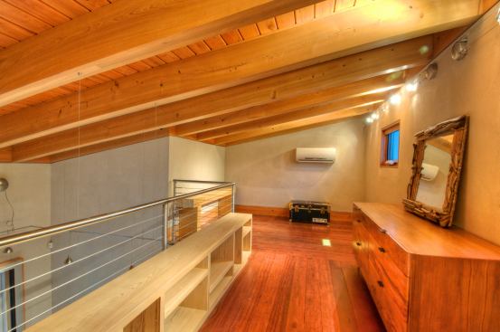 Upstairs, a loft offers space for storage.