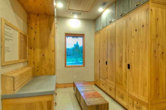 Native cypress offers a durable material with a comfortable feel for mud room cabinetry.