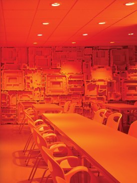 ImageNet, Carrollton, Texas, 2015 The cafe is washed in saturated orange-colored light to create a distinct environment.