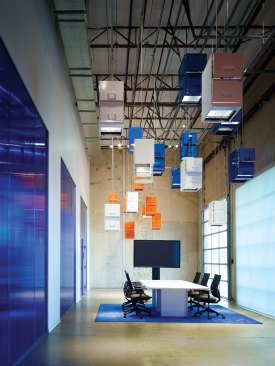 ImageNet, Carrollton, Texas, 2015 For one of ImageNet's recent offices, the architects used the company's corporate colorsâblue and orangeâto create distinct spaces, such as the cafe. The main conference room features a whimsical design element: a lighting installation made from repurposed filing cabinets suspended from the ceiling.