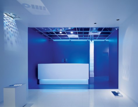 ImageNet, Dallas, 2004 In the reception area for one of ImageNet's first locations, a simple color palette of blue and white provides spatial clarity and reinforces the project's binary code theme, which is further highlighted by a supergraphic projection of “ones” and “zeros” on the side wall.