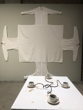 "Four People Wearing a Table" (1996-2020) and Coffee Seeks its Own Level" (1990-2020) by Allan Wexler