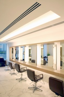 'An elongated light coffer creates an illuminated slot delivering plenty of light to a defined area: soft, glare free task lighting.'John Freida Salon, Mayfair, London