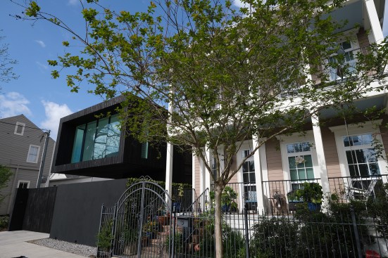 The charred-wood cladding on the J-House (at left) is a reference to, and abstraction of, the materiality of other houses in the neighborhood.