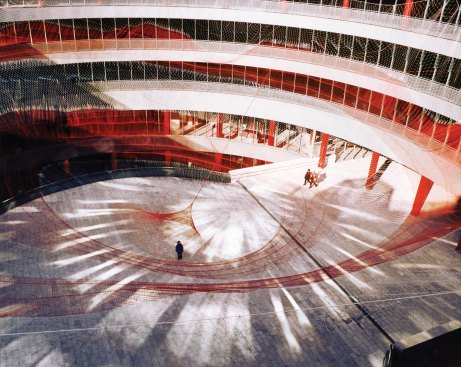 In 2001 Echelman designed “Target Swooping Down...Bullseye!” The 135-foot-wide by 90-foot-tall nylon lace net was attached to the perimeter of the atrium in the Spanish National Trade Fair Complex in Madrid.
