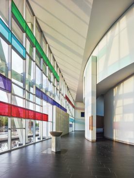 The angles of the façade, colored with Vanceva films from Eastman (see Curtainwall Light Box Detail), distort around the sanctuary’s curvilinear walls.