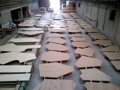Spanning 260 feet, the shell comprises 550 uniquely shaped, cross-laminated spruce panels stacked in three layers, which are protected by a top layer of 33-millimeter-thick Kerto Q LVL panels (shown above).
