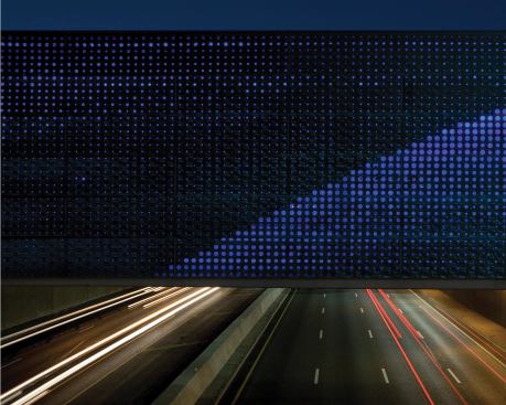 At night, the bridge takes on a new personality, lit from within by 60W RGB LED wallwash fixtures.