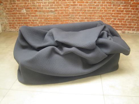 Hanna Emilie Ernsting's Moody couch for Kkaarrll's wears upholstery several sizes too big for it, inviting users to snuggle up. 
kkaarrlls.com
