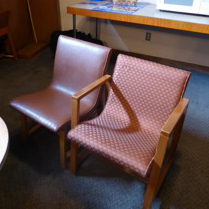 Two of the surviving chairs that Saarinen and Eames designed for Kleinhans. The version with armrests could be placed next to the version without, an ingenious space-saving device.
