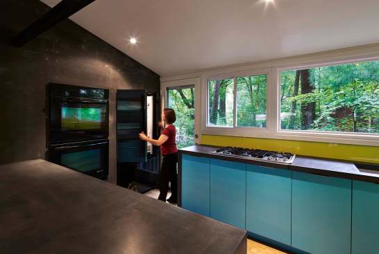 Architect Janet Bloomberg, who owns the house, says that switching to a door with a glass insert made a big difference in the amount of light coming into the kitchen.