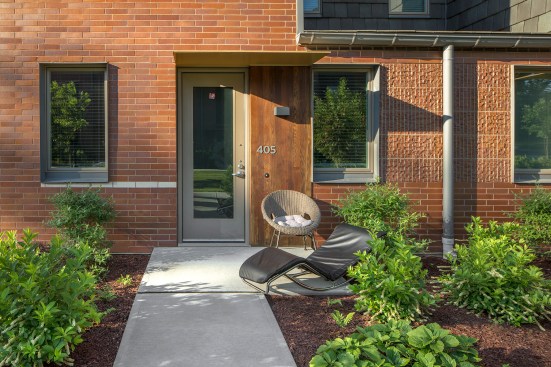 Exteriors feature smooth ironspot brick with patches of rough artisan brickwork