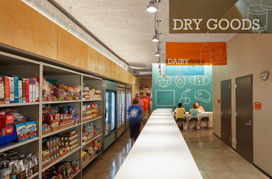 A zigzagging Corian counter provides wayfinding and reflects daylight.