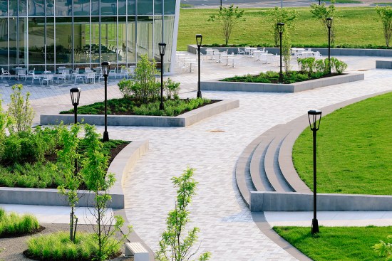 The bluestone pavers and benches create a unified aesthetic that invites people to use the space.