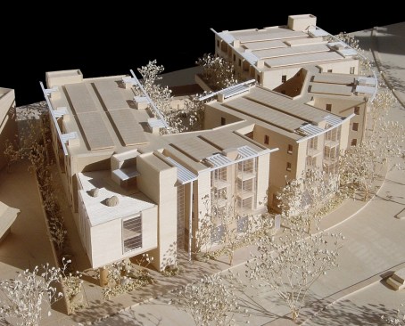 A model details the Leigh Avenue Senior Apartments, which will be four stories, with a first floor concrete podium and three stories of wood frame construction above. Parking and commercial space will be located at the ground level and residential units will be located on the upper floors. The project will be built to achieve LEED Platinum designation.