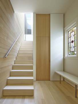 Indirect light floods into this stairway.
