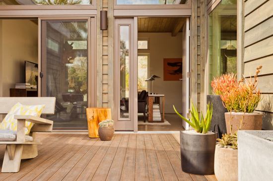 Multiple sliding glass doors provide access to the courtyard.