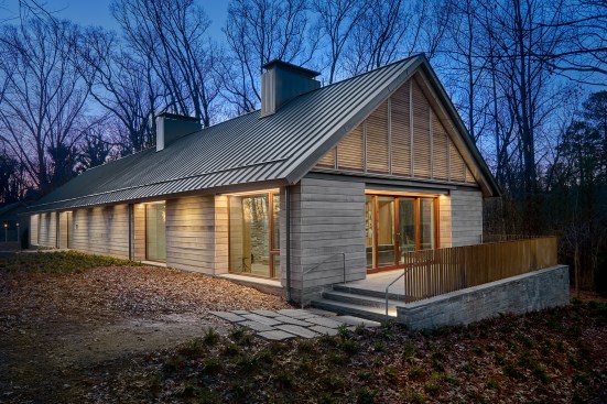 Loghaven Artist Residency at dusk; designed by Sanders Pace Architecture with lighting by Sighte Studio