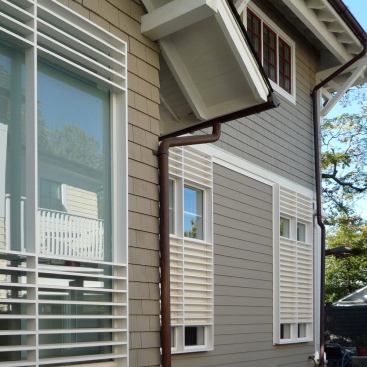 Exterior louvers screen views of close neighbors.