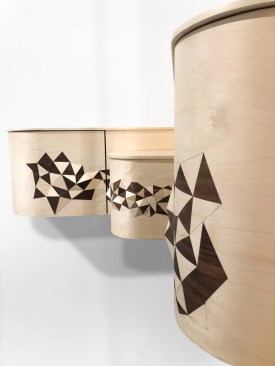 Polygonal Corner Furniture, by Studio Line & Raphaël, uses 3D modeling, digital cutting and 3D printing allowing the designers to push the limits of traditional marquetry whereby the wood veneer pattern gradually takes on relief and comes to life.