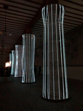 Students from the Darmstadt University of Applied Sciences wrapped columns of a 13th-century monastery-turned-museum in blue LED strips for their “Light Without End” installation.