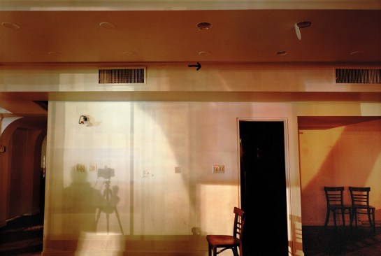 Hudson Street, New York City “When I took the photograph, the light from a streetlight outside this former restaurant created my spot-lit shadow on the wall. ” -- Lynn Saville
